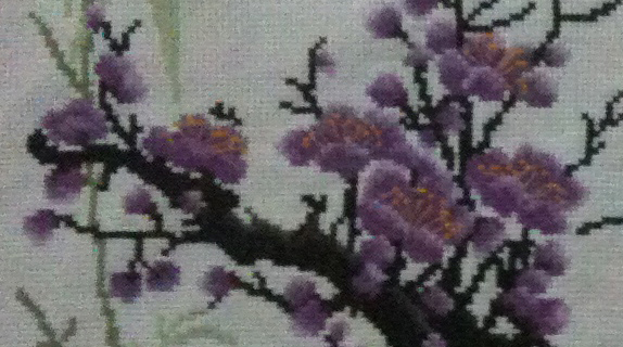 closeup of the stitch handwork: flowers